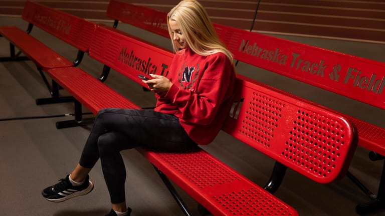 Nebraska NCAA college pole vaulter Jessica Gardner looks at her...