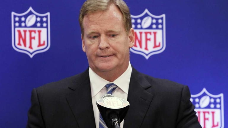 NFL Commissioner Roger Goodell listens to questions during a news...