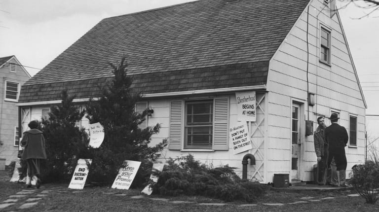 The Cotter house was plastered with signs in a last...