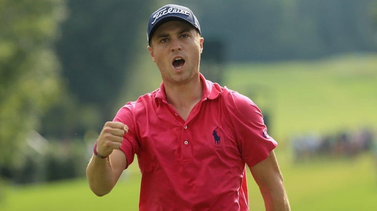 Justin Thomas reacts to his birdie putt on the 13th...