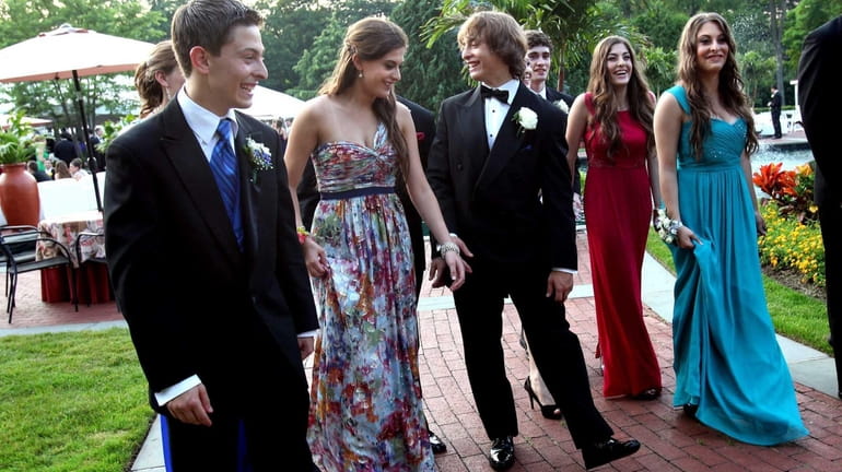 The Carbone quintuplets attend their prom at Woodbury Country Club....