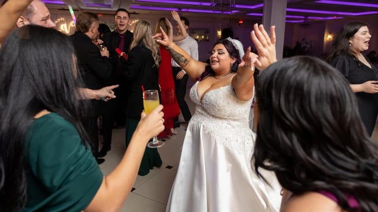 Valerie Manzo, center, dances with guests on her wedding day.