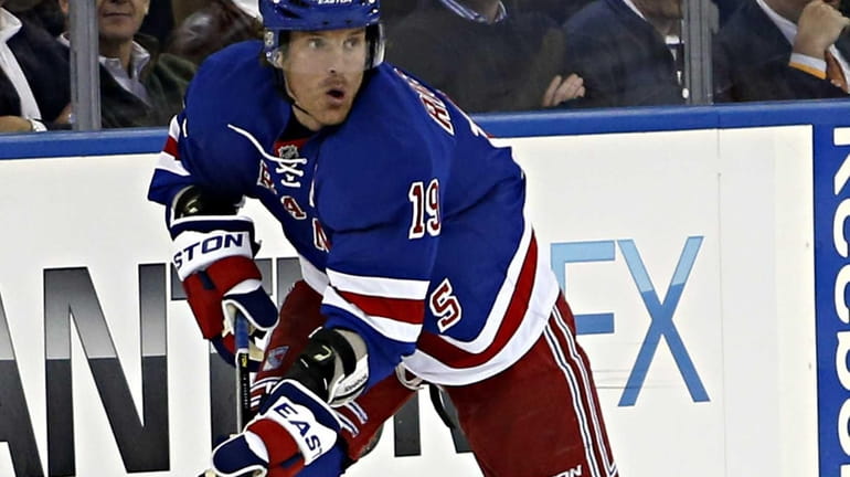 Rangers center Brad Richards looks to make a pass in...