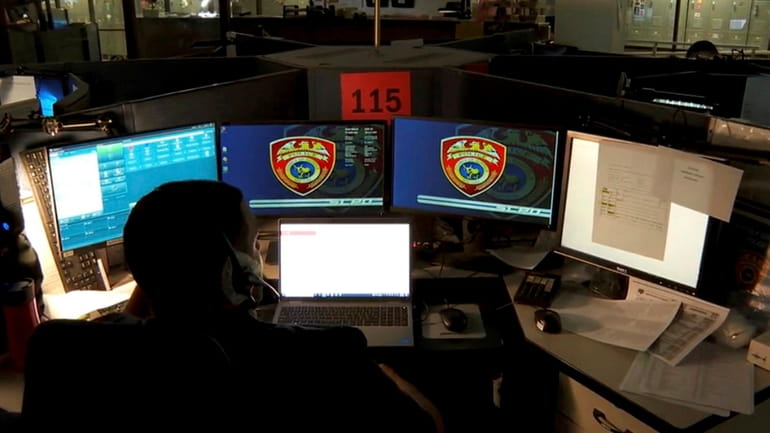A 911 operator receives a 911 call at Suffolk County...