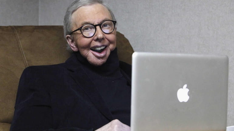 Pulitzer Prize-winning movie critic Roger Ebert works in his office...