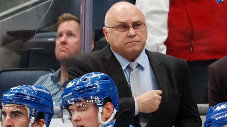 New York Islanders head coach Barry Trotz looks on in...