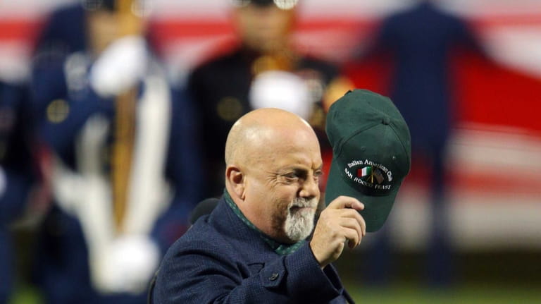 Billy Joel performs the National Anthem before Game 3 of...