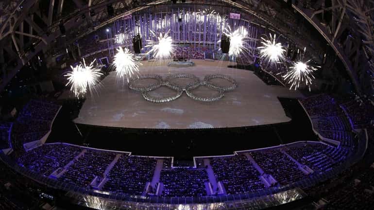 Actors line up to show the Olympic rings during the...