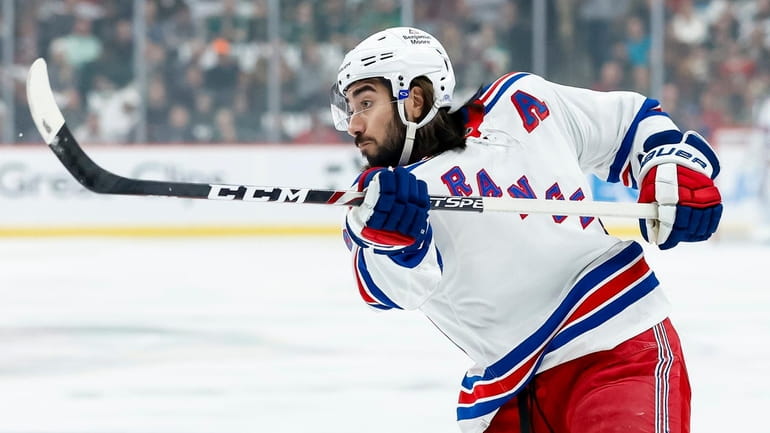 Mika Zibanejad of the New York Rangers shoots the puck against...
