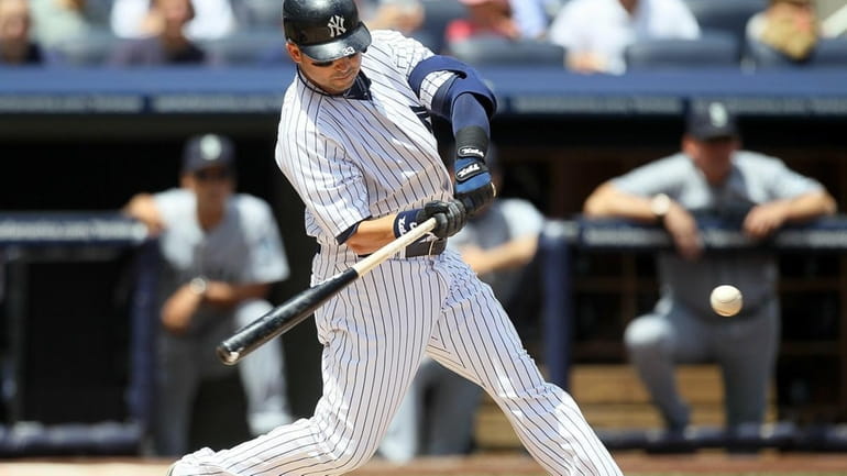 The Yankees' Nick Swisher connects on a first-inning double against...