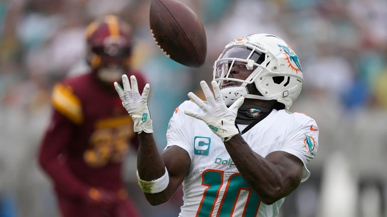 Miami Dolphins wide receiver Tyreek Hill (10) catches a touchdown...