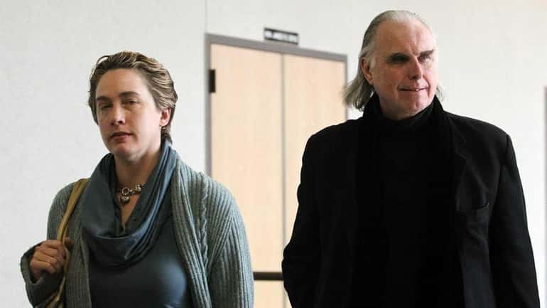Donald MacPherson and his wife, Carrie Coakley, leaving a Riverhead...