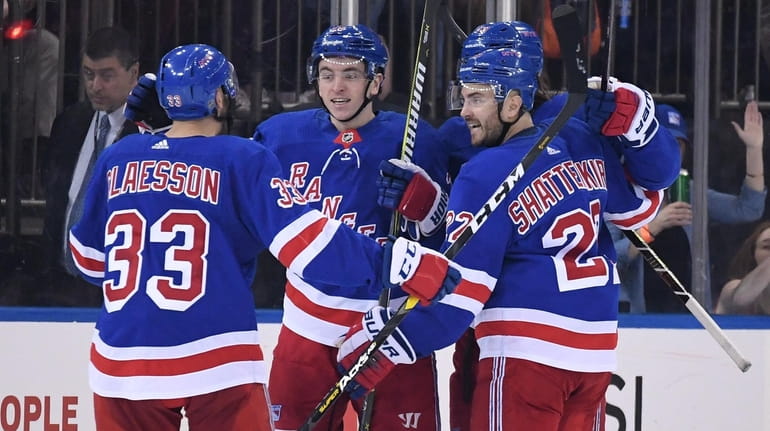 Rangers left wing Jimmy Vesey, second from left, celebrates his...