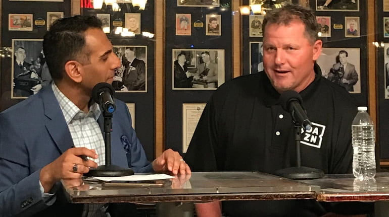Adnan Virk and Roger Clemens speak Tuesday during an event...