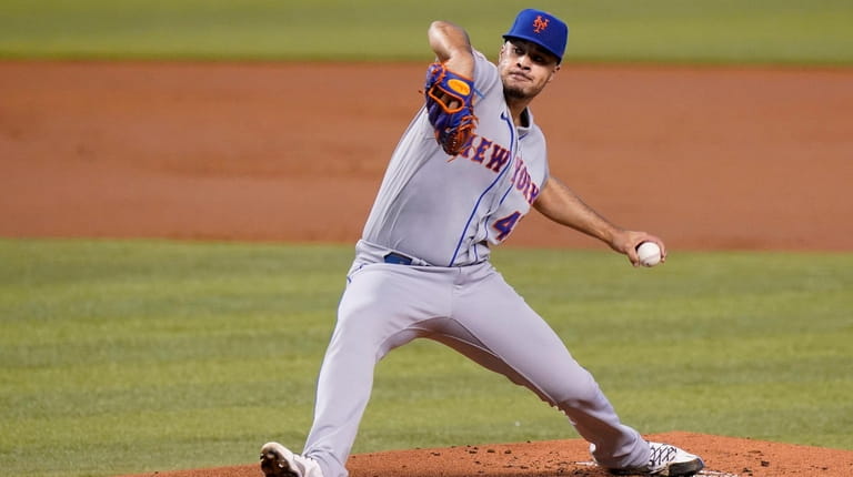 New York Mets starting pitcher Joey Lucchesi throws during the...