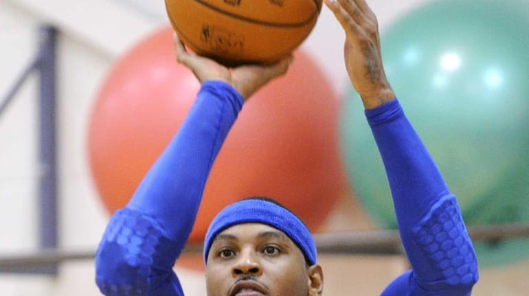 Carmelo Anthony shoots during training camp. (Oct. 1, 2013)