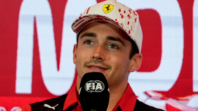 Ferrari driver Charles Leclerc of Monaco answers to reporters during...