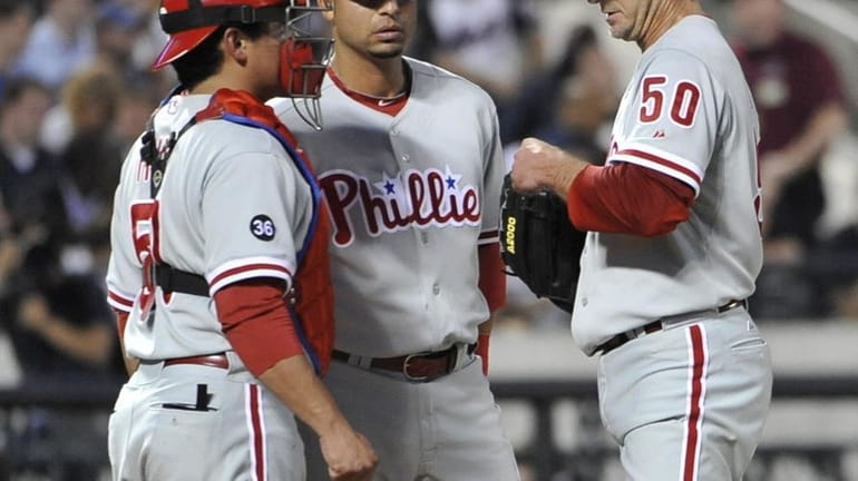Phillies' catcher, Carlos Ruiz and shortstop, Juan Castro meet with...