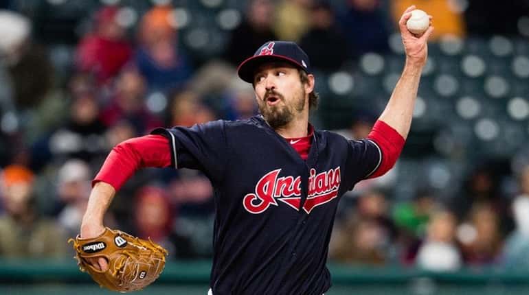 Andrew Miller of the Indians pitches during the ninth inning...