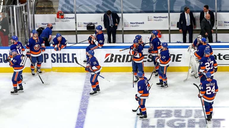The Islanders leave the ice after their 2-1 overtime loss...