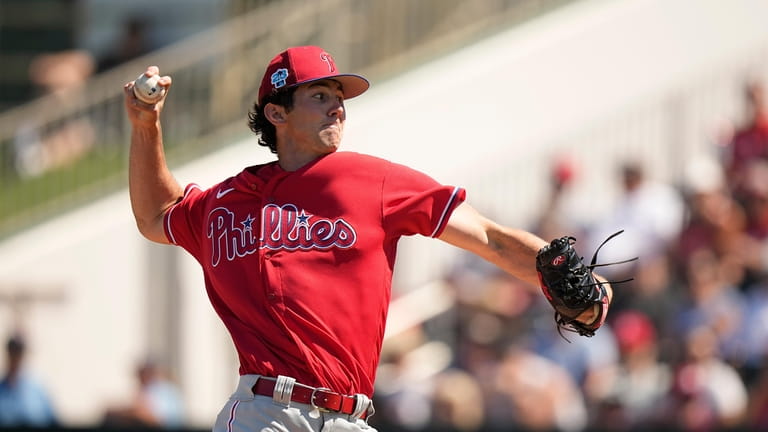 Philadelphia Phillies' pitcher Andrew Painter, delivers in the first inning...