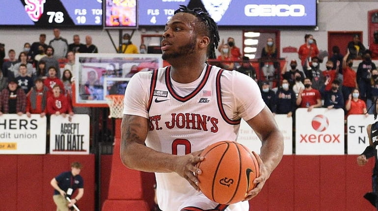 St. John's Red Storm guard Posh Alexander drives to the...