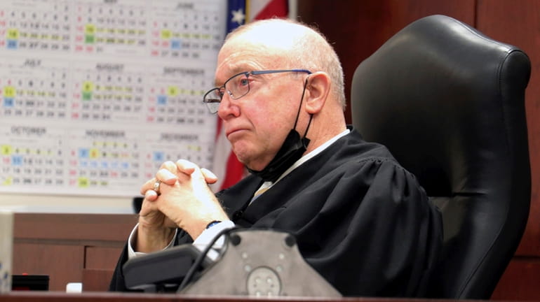 Judge Patrick McAllister listens to arguments during a hearing in...
