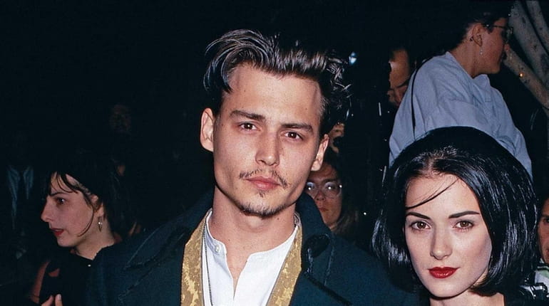 Actor Johnny Depp and actress Winona Ryder arrive at the...