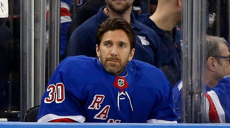 Henrik Lundqvist #30 of the Rangers looks on during the...