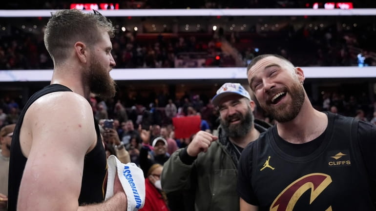 Cleveland Cavaliers forward Dean Wade, left, celebrates with Jason Kelce,...