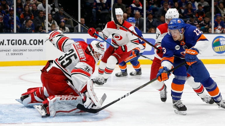 Hurricanes goalie Curtis McElhinney stops a scoring chance during the...