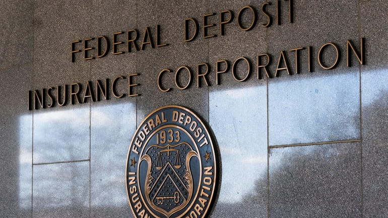 The Federal Deposit Insurance Corporation (FDIC) seal is shown outside...