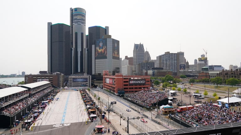 Fans watch the IndyCar Detroit Grand Prix auto race next...