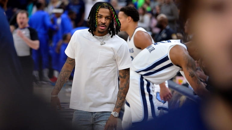 Memphis Grizzlies guard Ja Morant stands on the sideline before...