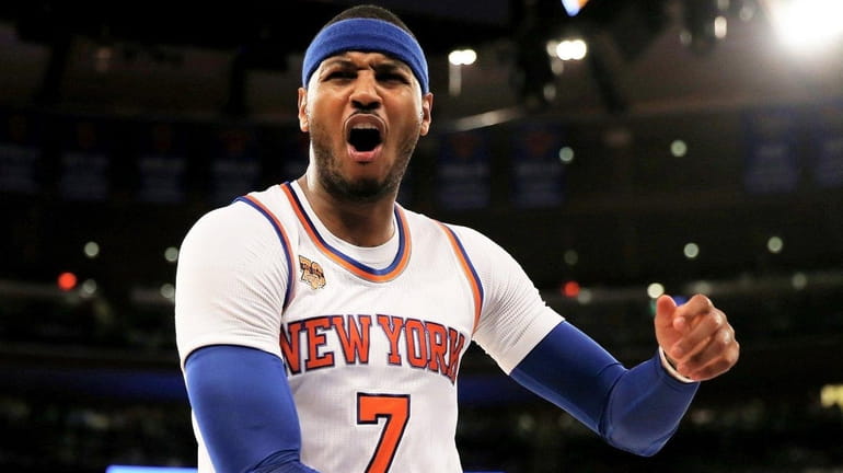 The Knicks' Carmelo Anthony is called for a foul in...