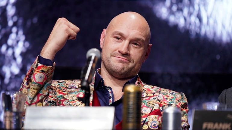 British WBC and lineal heavyweight champion Tyson Fury gestures during...