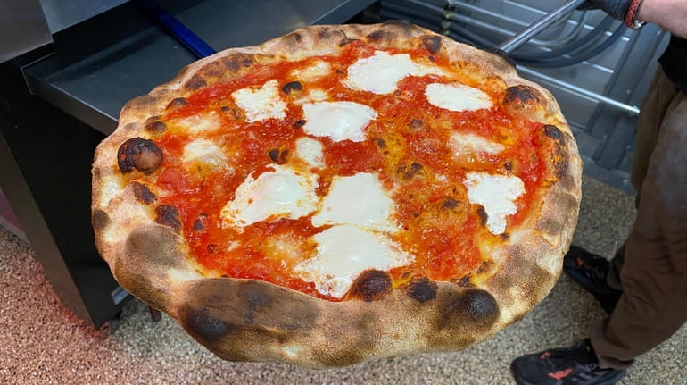 The new pizzas at King Umberto in Elmont combine the lightness and...