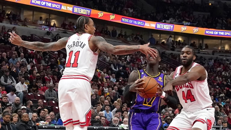 Los Angeles Lakers' Dennis Schroder drives to the basket as...