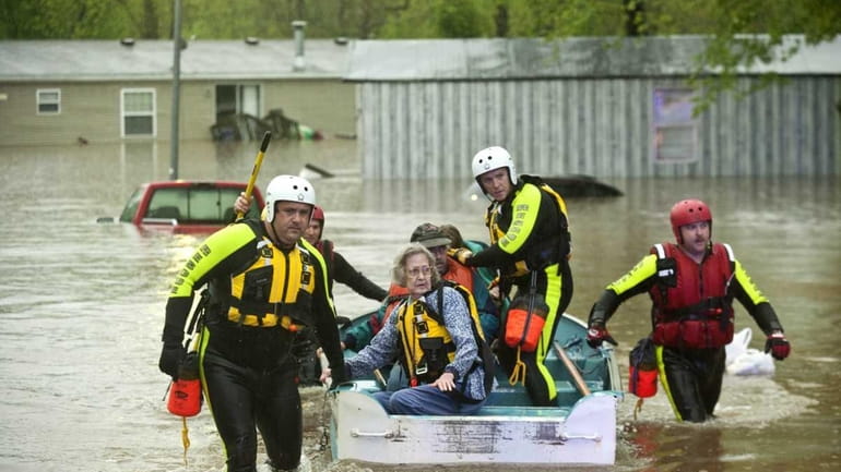 Residents of Oak Glen Residential Community are assisted by rescue...