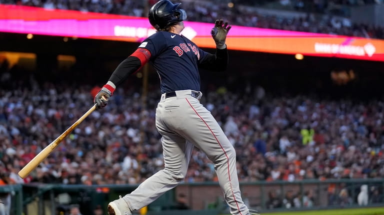 Boston Red Sox's Triston Casas watches his home run against...