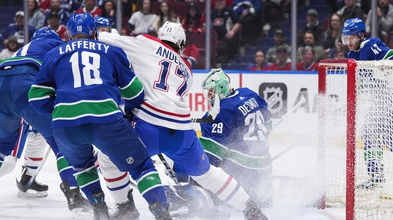 Vancouver Canucks goalie Casey DeSmith (29) stops Montreal Canadiens' Josh...