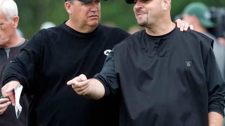 Head coach Rex Ryan, left, talks with Jets defensive coordinator...