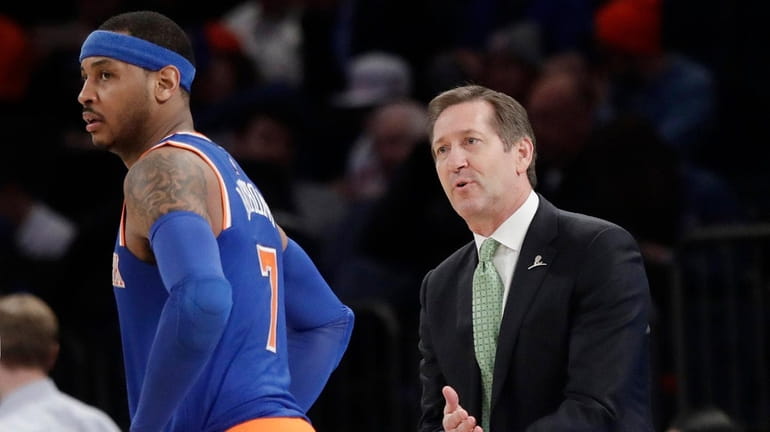 New York Knicks coach Jeff Hornacek, right, talks to Carmelo...