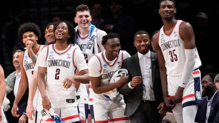 UConn guard Tristen Newton (2) and his teammates react in...