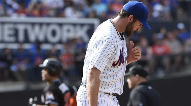 New York Mets starting pitcher Jonathon Niese reacts after Miami...