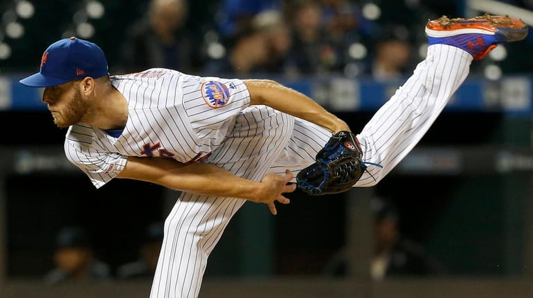 Zack Wheeler of the Mets pitches during the seventh inning...