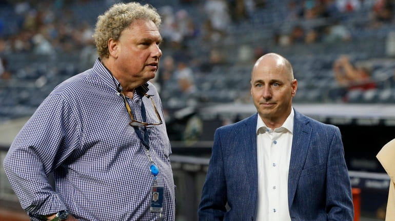 New York Yankees president Randy Levine (L) and general manager...