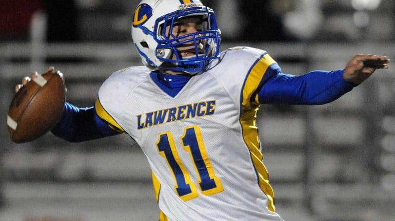 Lawrence quarterback Joe Capobianco completes a pass on fourth and...