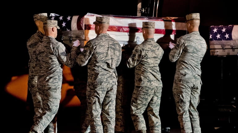 The remains of Master Sgt. Christopher Raguso of Commack are received...