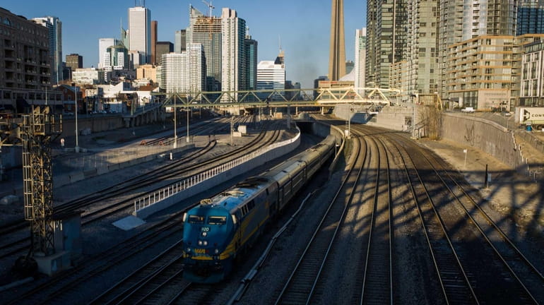 A VIA Rail train leaves Union Station in Toronto, Ontario,...
